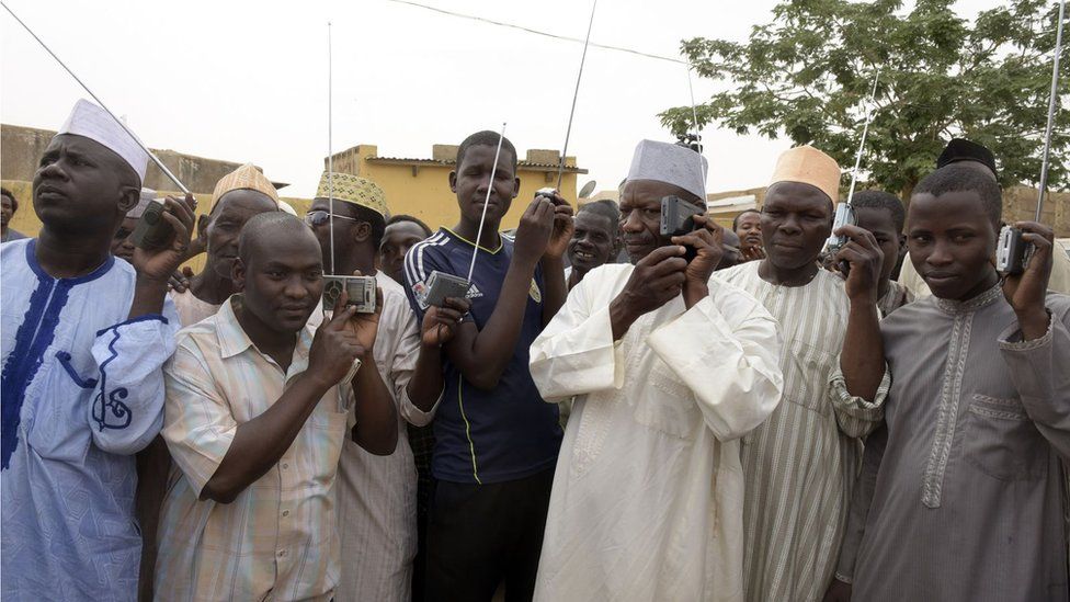 Men listening to radio